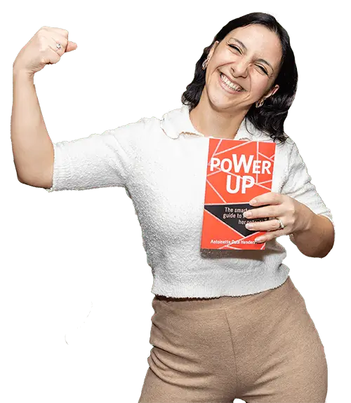 Woman holding the Power Up Book by Antoinette Dale Henderson